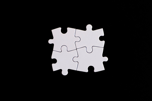 Four white Puzzle Pieces Connected, copy space for your text.