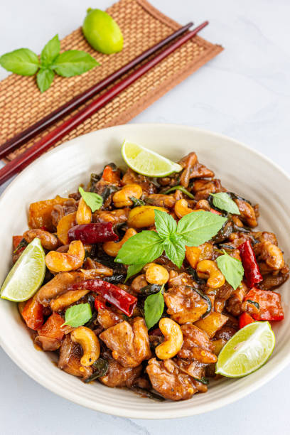 istock Stir-Fried Chicken with Vegetables Garnished with Thai Basil 1312630844