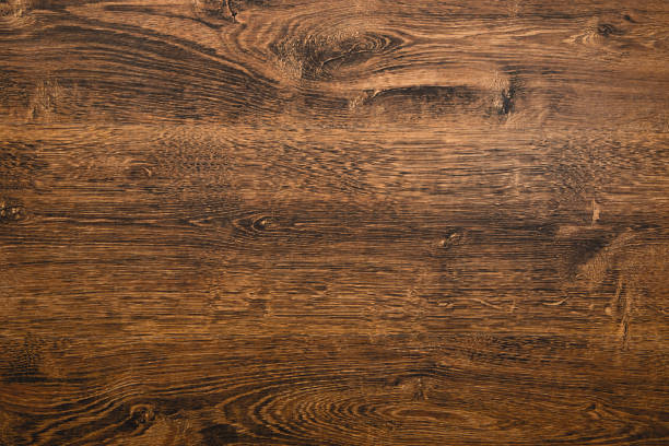 istock background dark brown wood 1312631171