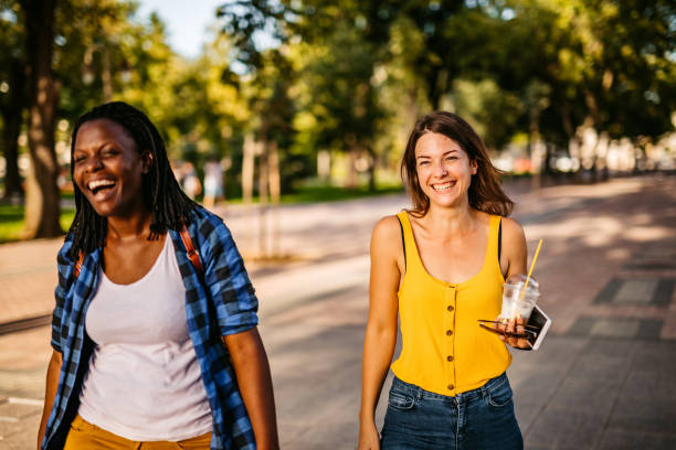 istock Friends walking through park and having fun 1312633584