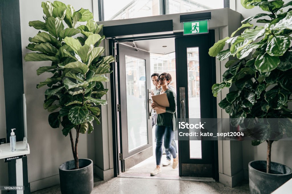 Acquisitions & Dispositions: The Role of the Real Estate Asset Manager.Two entrepreneurs in the office Office Stock Photo