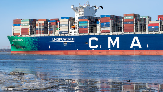 The LNG-powered containership, the CMA CGM Louvre, on the river Elbe near the city of Hamburg, Germany. Ship is leaving the port of Hamburg on Sunday the 14th of February 2021.\