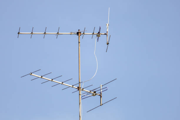 istock The old TV antenna pole on blue sky 1312634953