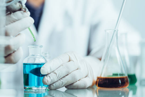 istock Hand of Biochemical research scientist working with science laboratory test tubes for coronavirus vaccine development in pharmaceutical research labolatory. 1312635081