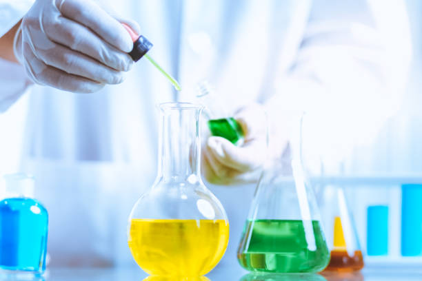 istock Hand of Biochemical research scientist working with science laboratory test tubes for coronavirus vaccine development in pharmaceutical research labolatory. 1312635121
