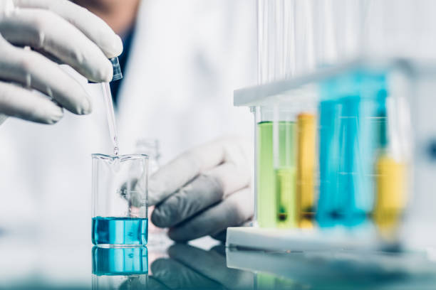 istock Hand of Biochemical research scientist working with science laboratory test tubes for coronavirus vaccine development in pharmaceutical research labolatory. 1312635145