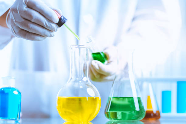 istock Hand of Biochemical research scientist working with science laboratory test tubes for coronavirus vaccine development in pharmaceutical research labolatory. 1312635876