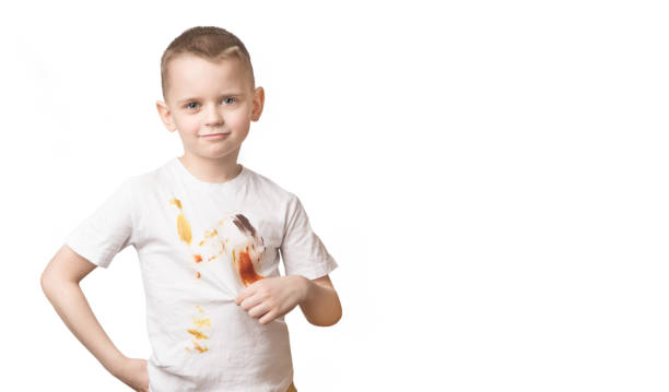 istock Boy in dirty t-shirt from eating isolated on white background 1312636775