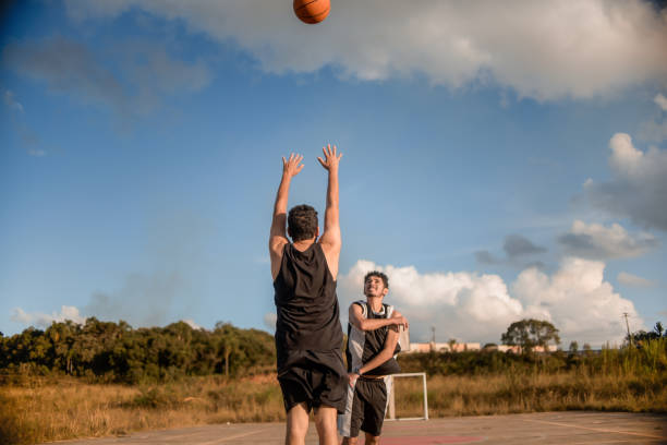 istock Friends playing basketball 1312637238