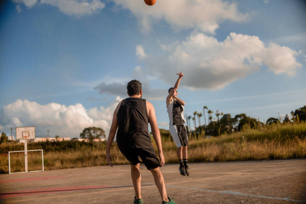 istock Friends playing basketball 1312637245