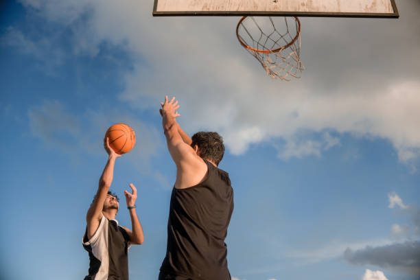 istock Friends playing basketball 1312637266