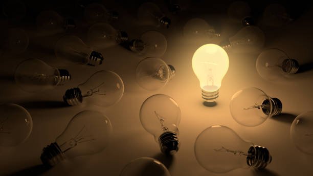 istock One glowing light bulb standing among other lying not working bulbs 1312638252