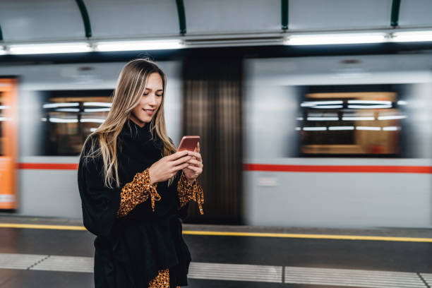 istock Woman checking ride schedule on phone 1312638632
