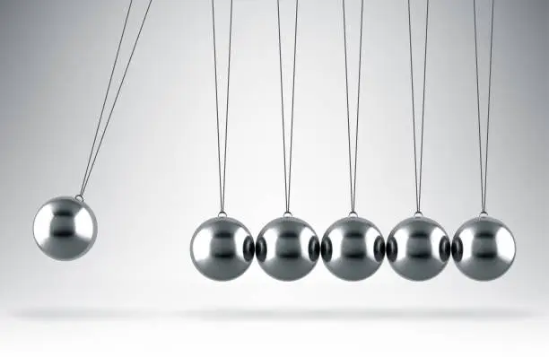 Vector illustration of Balancing balls Newton's cradle hanging on gray background