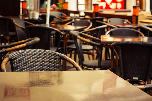 istock Empty street cafe with tables and chairs 1312639948