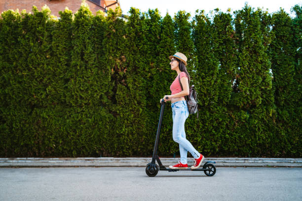 istock Young woman driving electric scooter 1312640187