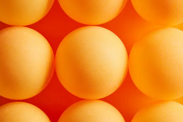 Photo of Orange table tennis or ping pong lottery balls.