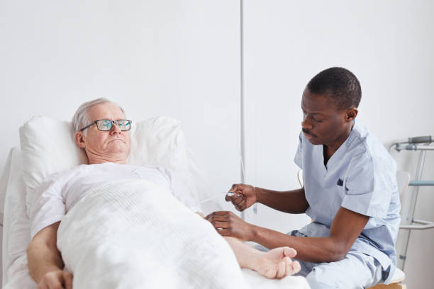 istock Male Nurse Caring for Patient 1312641947