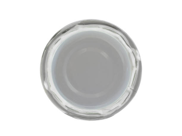 closed with a metal lid, an empty glass bottle for sauces. isolated on a white background top view - cork tops imagens e fotografias de stock