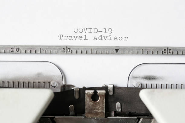 istock COVID-19 Travel Advisor text on blank paper typed on a retro typewriter 1312645348