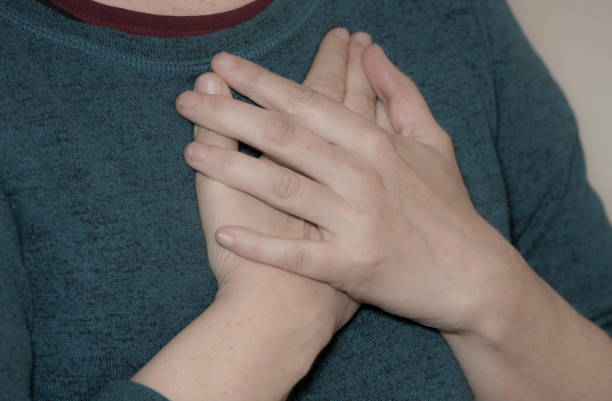 istock person having a heart attack 1312645420