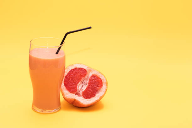 istock Fresh orange smoothie with a grapefruit or orange tube 1312646709