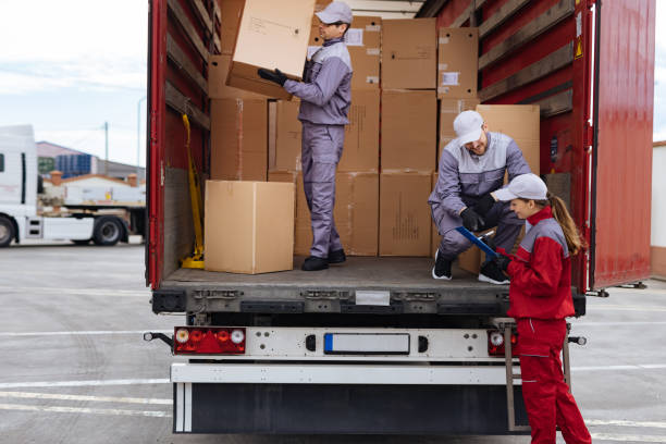 istock A group of delivery workers loading a delivery truck 1312647356