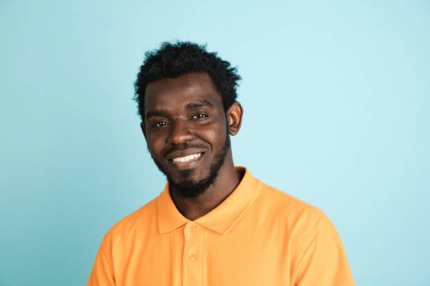istock African man's portrait isolated over blue studio background with copyspace 1312649642