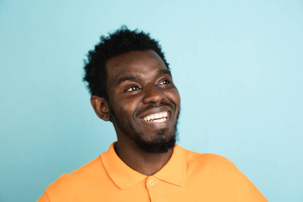 istock African man's portrait isolated over blue studio background with copyspace 1312649643