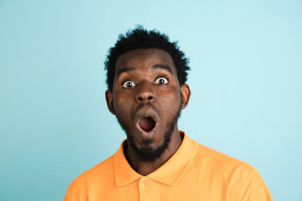 istock African man's portrait isolated over blue studio background with copyspace 1312649654