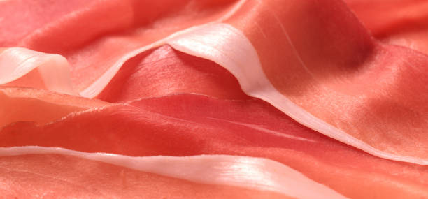 cured ham macro slices of cured ham in macro prosciutto stock pictures, royalty-free photos & images