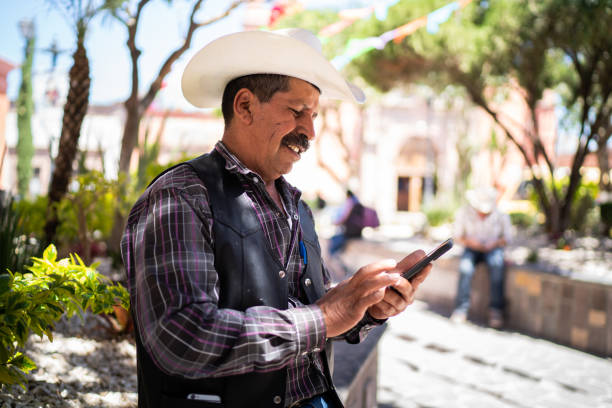 istock Senior man using smartphone outdoors 1312649753