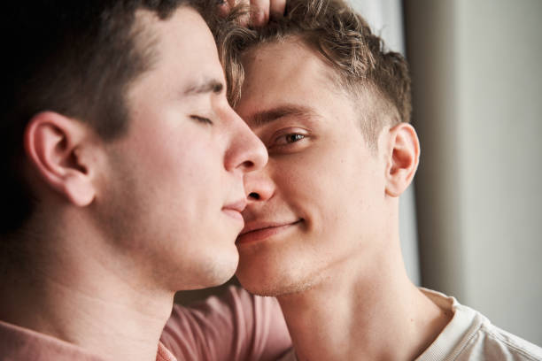 istock Man looking at the camera near his boyfriend while spending time together 1312650572