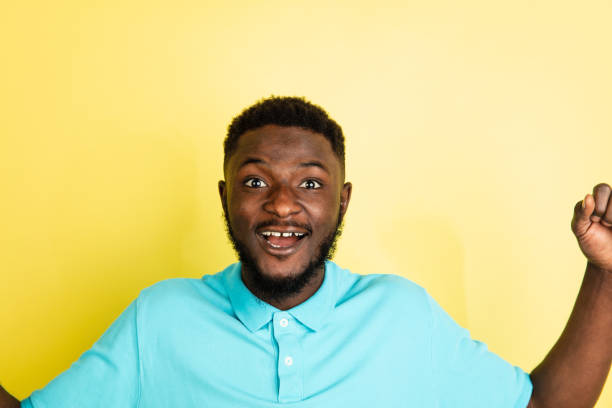 istock Portrait of young African man isolated over yellow studio background with copyspace. 1312652341