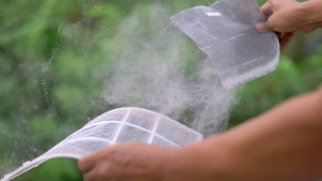Man Clean Dust On Air Filter