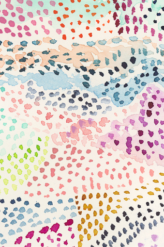 Watercolor background dotted mixed colors