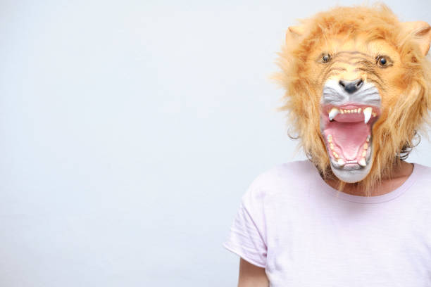 istock Female in an angry lion mask 1312655850