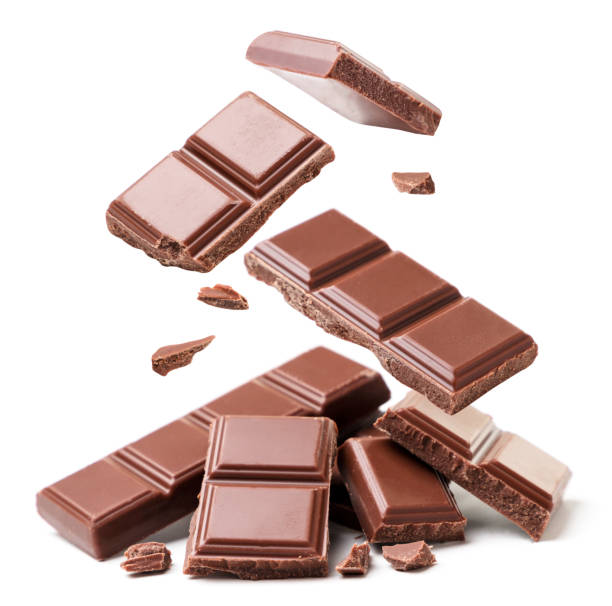 istock Pieces of chocolate fall on a heap on a white background, levitating chocolate. Isolated 1312656592