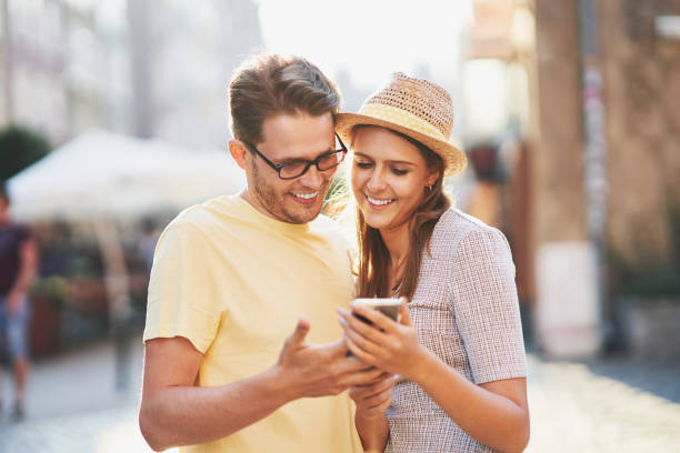 istock Happy tourists sightseeing during summer holidays 1312657307