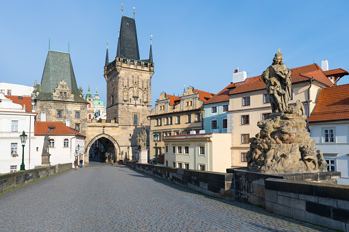 Amazing Sunny day on Charles bridge and historical center of Prague, buildings and landmarks of old town, Prague, Czech Republic Prague during quarantine restrictions. Spring or summer time.