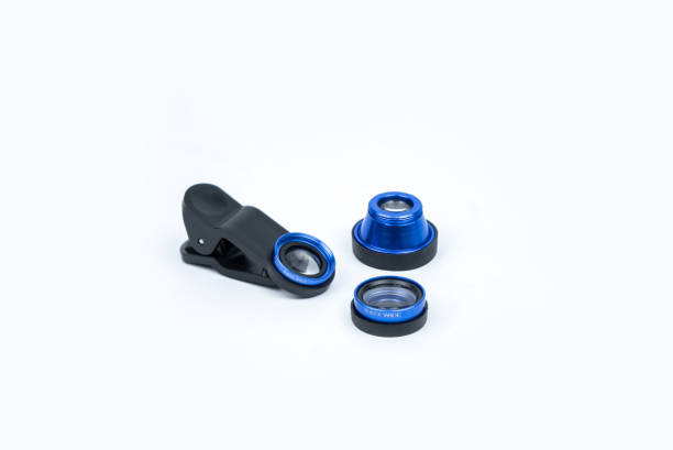 istock Phone photo lens with clips on white background. Extra macro camera for smartphone. Set of lenses wide angle, fish eye and macro 1312658902