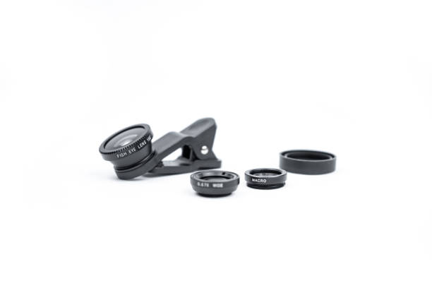 istock Phone photo lens with clips on white background. Extra macro camera for smartphone. Set of lenses wide angle, fish eye and macro 1312658918