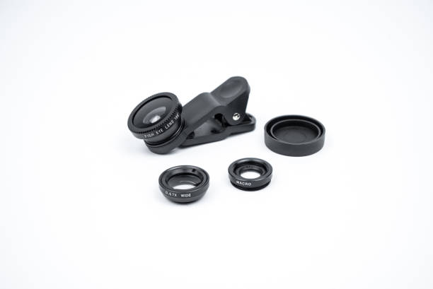 istock Phone photo lens with clips on white background. Extra macro camera for smartphone. Set of lenses wide angle, fish eye and macro 1312658922