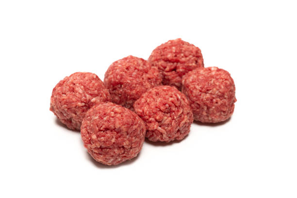 istock Raw meat balls isolated on white background. 1312659009