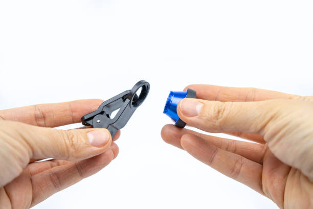 istock Phone photo lens with clips on white background. Extra macro camera for smartphone. Set of lenses wide angle, fish eye and macro 1312659182
