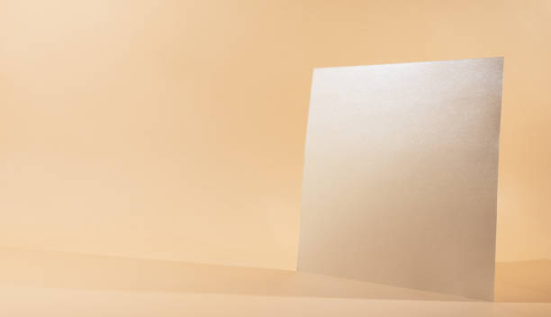 istock Paper sheet or blank card on beige background. 1312660798