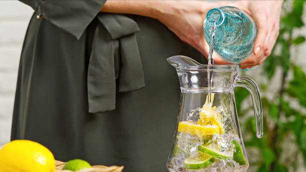 istock A woman pours lemonade into a glass 1312660888