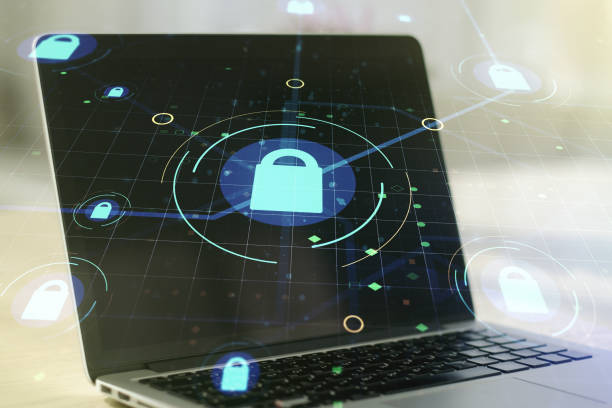istock Double exposure of creative lock hologram with chip on laptop background. Information security concept 1312663045