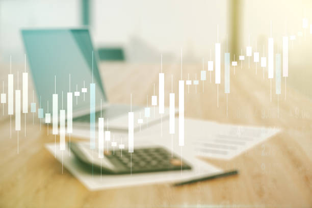 Multi exposure of virtual abstract financial diagram on calculator and pc background, banking and accounting concept