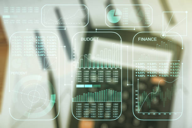 istock Multi exposure of creative statistics data hologram on blurry calculator background, stats and analytics concept 1312663108